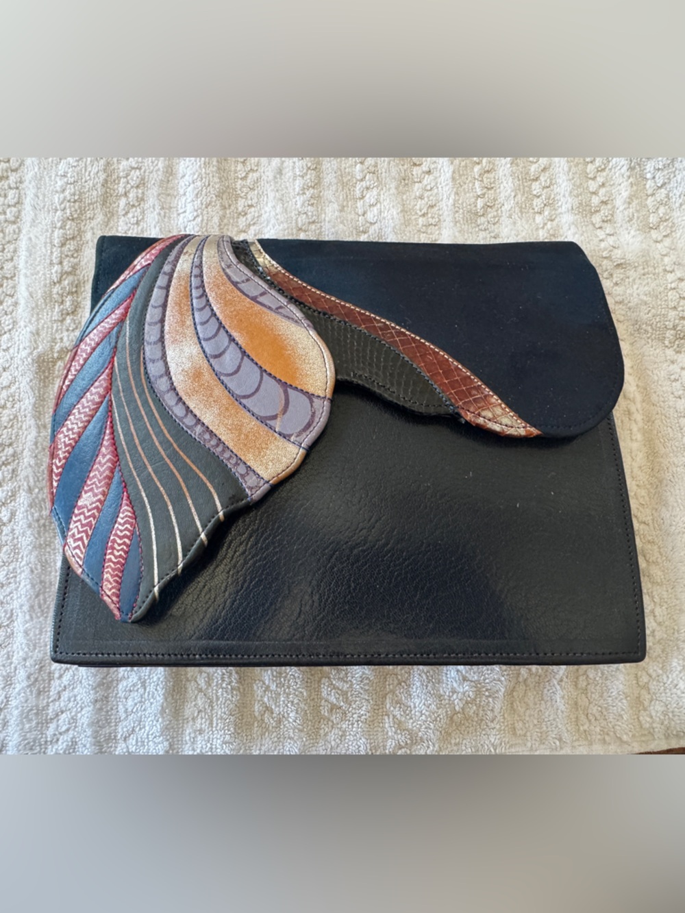 vintage handmade leather clutch by the British designer Nigel Lofthouse.
